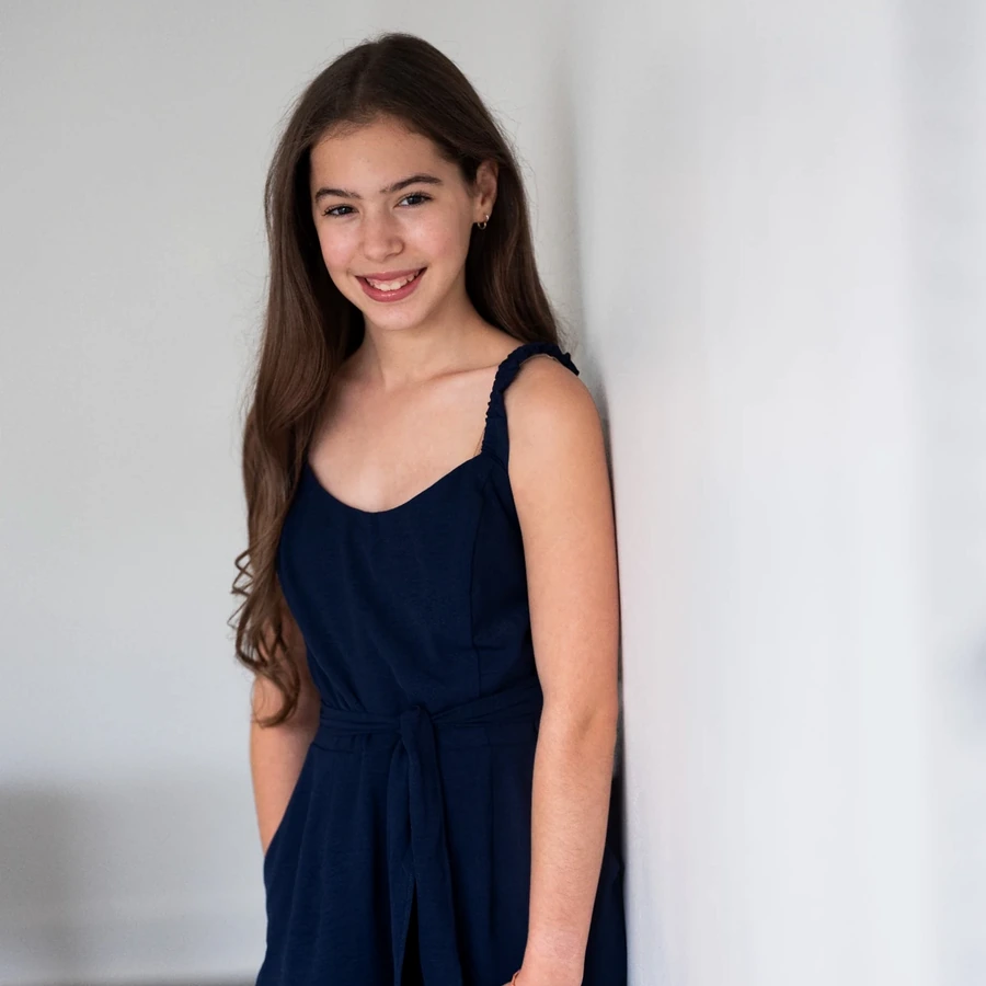 Headshot of Samara DiGregorio in a navy dress