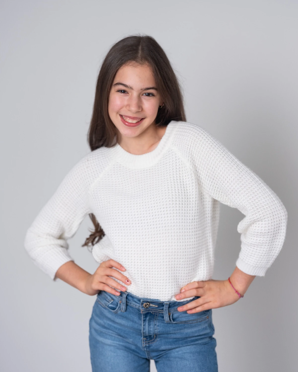 Samara in a white sweater