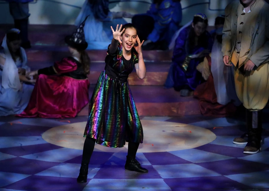 Samara performing under stage lights